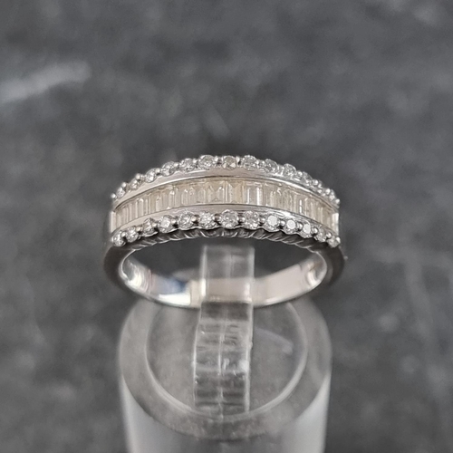 270 - An 18ct white gold diamond half eternity ring, set with a row of eighteen channel set baguette diamo... 