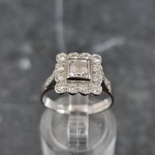 272 - An 18ct white gold diamond cluster ring, set  Asscher cut diamond surrounded by twelve brilliant cut... 