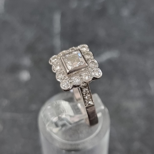 272 - An 18ct white gold diamond cluster ring, set  Asscher cut diamond surrounded by twelve brilliant cut... 