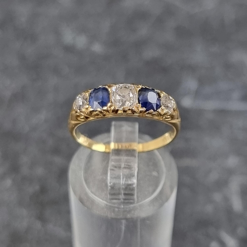 273 - A Victorian yellow metal diamond and sapphire five stone ring, stamped '18ct', size N.... 