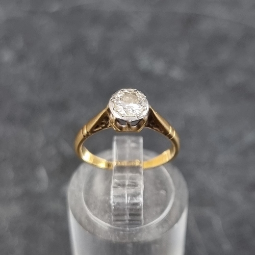 275 - A yellow metal diamond solitaire ring, stamped '18ct/plat', size G1/2.