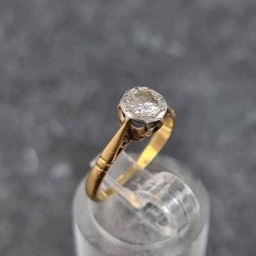 275 - A yellow metal diamond solitaire ring, stamped '18ct/plat', size G1/2.