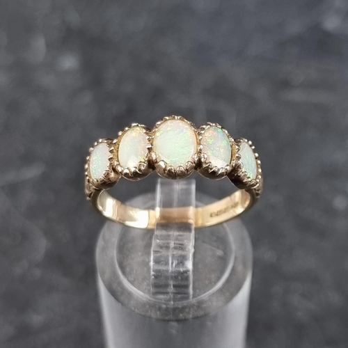 277 - A 9ct gold opal five stone ring, size O1/2, gross weight 3.1g.