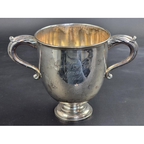 29 - A large silver twin handled trophy cup, by Garrard & Co Ltd, London 1922, with inscription, 18.5... 