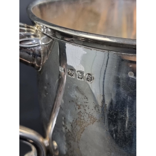 29 - A large silver twin handled trophy cup, by Garrard & Co Ltd, London 1922, with inscription, 18.5... 