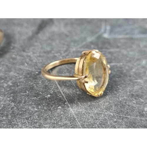 292 - Two 9ct gold gem set rings, gross weight 5.4g; together with two similar yellow metal rings, stamped... 