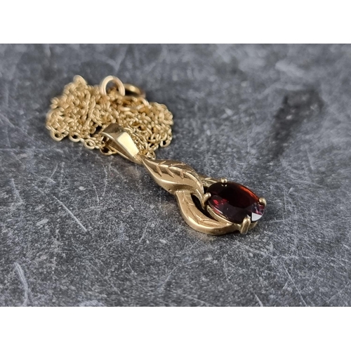 293 - A 9ct gold garnet pendant, on 9ct gold chain; together with a 9ct gold floral cluster ring, set seve... 