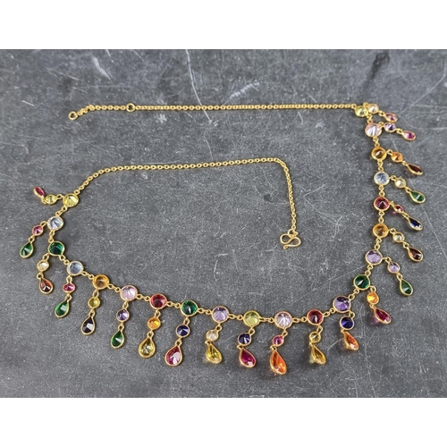 299 - A yellow metal necklace, set multiple coloured gemstones, 45cm.