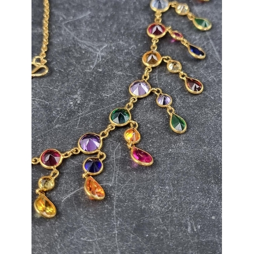 299 - A yellow metal necklace, set multiple coloured gemstones, 45cm.