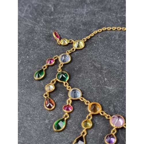 299 - A yellow metal necklace, set multiple coloured gemstones, 45cm.