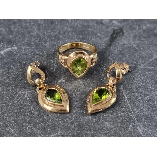 300 - A 9ct gold ring, set pear shaped peridot, size L, gross weight 4.2g; together with a matching pair o... 