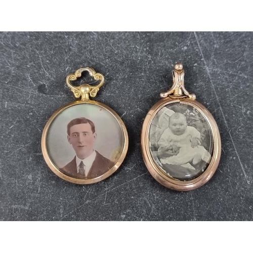 304 - A 9ct gold portrait pendant, Chester 1913, 26mm diameter; together with another similar yellow metal... 