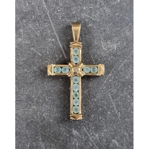 308 - A 9ct gold cross pendant, set one diamond and eleven aquamarines, 30mm high, gross weight1.7g.... 