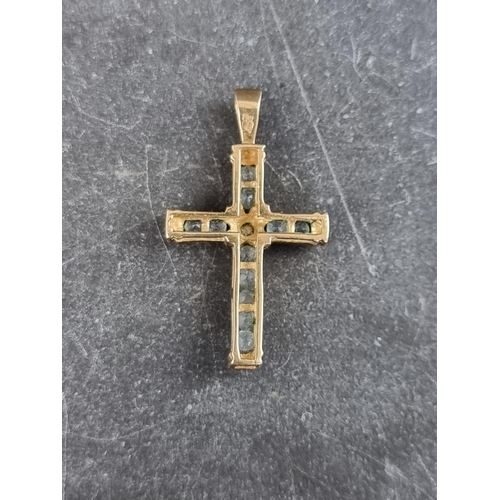 308 - A 9ct gold cross pendant, set one diamond and eleven aquamarines, 30mm high, gross weight1.7g.... 