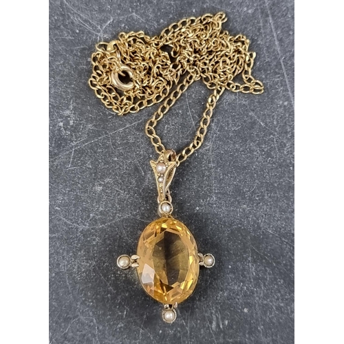 310 - An early 20th century yellow metal pendant, set faceted citrine and split pearls, 32mm high; on 9ct ... 