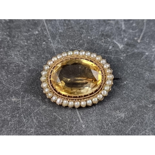 313 - A gold plated citrine and split pearl brooch, 28mm wide, with steel pin.