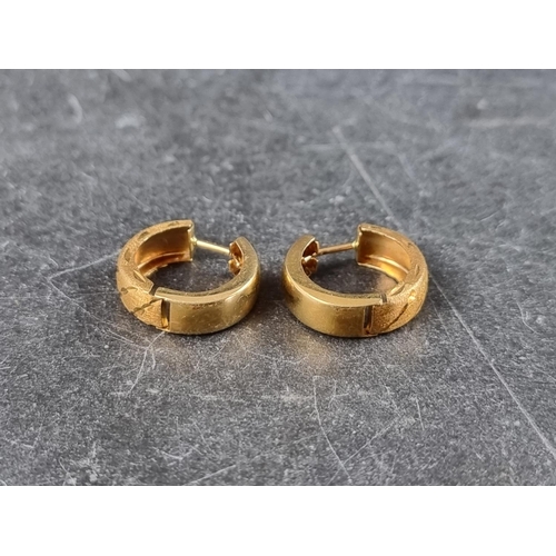 314 - A pair of yellow metal earrings, stamped '18k'.