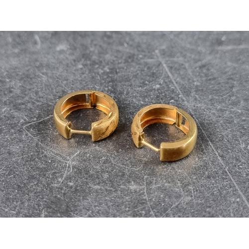 314 - A pair of yellow metal earrings, stamped '18k'.