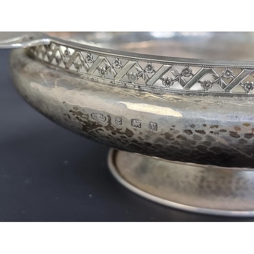 34 - A hammered silver quaich style bowl, by Albert Edward Jones, Birmingham 1945, 28cm wide, 331g.... 