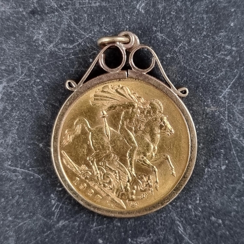 422 - Coins: a George V 1927 gold sovereign, mint mark SA, in a 9ct gold pendant mount, gross weight 9.5g.... 