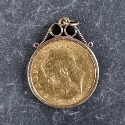 422 - Coins: a George V 1927 gold sovereign, mint mark SA, in a 9ct gold pendant mount, gross weight 9.5g.... 