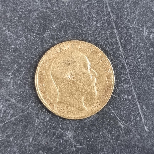 425 - Coins: an Edward VII 1903 gold half sovereign.