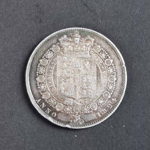 435 - Coins: a George IV 1824 silver half crown.