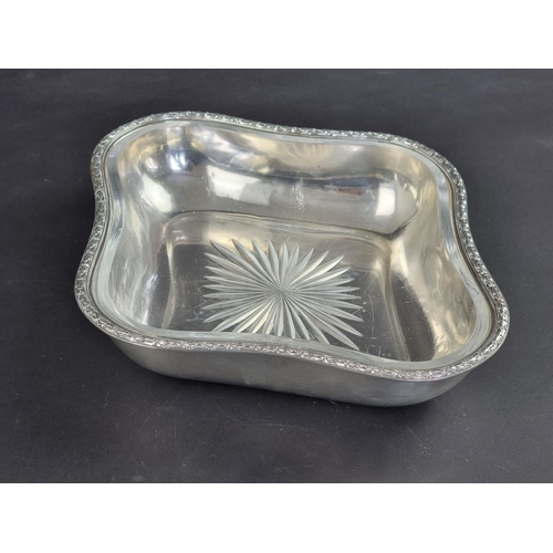 44 - A German white metal serving bowl, stamped '800', with glass liner, 29cm wide.