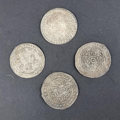 444 - Coins: four silver Tibetan tangka coins.