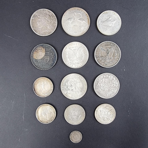 446 - Coins: a quantity of world coins, to include three US silver dollars 1879, 1921 and 1922.... 