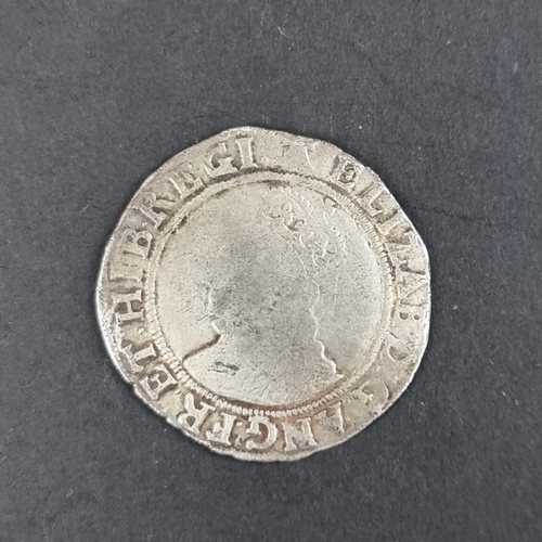 447 - Coins: an Elizabeth I silver shilling, sixth issue 1582-1600, 5.9g, without rose or date.... 