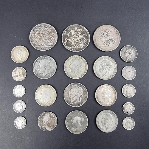 448 - Coins: a group of UK silver and part silver coinage, to include a William III 1697 silver shilling a... 