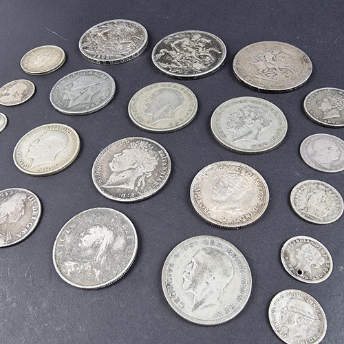 448 - Coins: a group of UK silver and part silver coinage, to include a William III 1697 silver shilling a... 