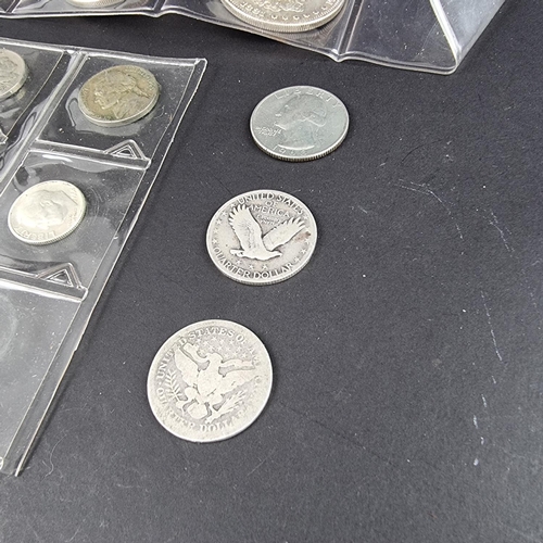 452 - Coins: three US silver dollars; 1881 mintmark S, 1921 and 1923; together with thirteen other US coin... 