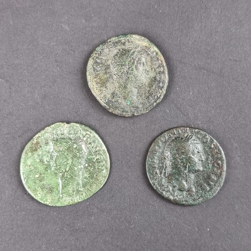 464 - Coins: three Roman coins, comprising: a Hadrian AD 117-138 AE dupondius; a Claudius AD 41-54 AE dupo... 