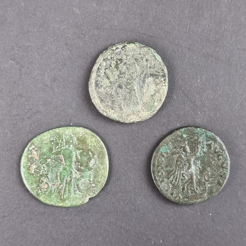 464 - Coins: three Roman coins, comprising: a Hadrian AD 117-138 AE dupondius; a Claudius AD 41-54 AE dupo... 