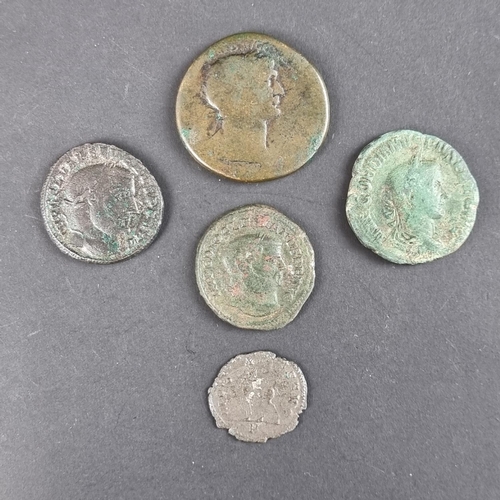 465 - Coins: five Roman coins; to include a Trajan AD 98-117 AD sestertious; and a Diocletian AD 284-305 A... 