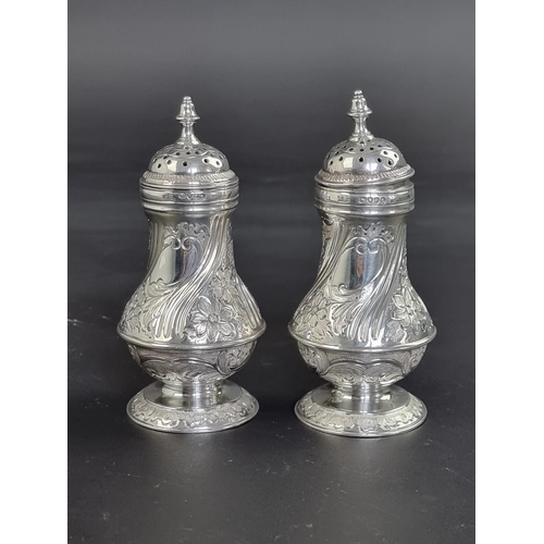 49 - A pair of Victorian silver pepperettes, by J B, London 1883, 11.5cm high, 157g.