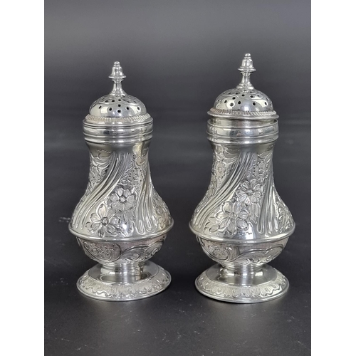 49 - A pair of Victorian silver pepperettes, by J B, London 1883, 11.5cm high, 157g.