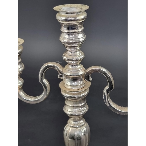 51 - A German white metal three light candelabrum, stamped '925S', 27.5cm high.