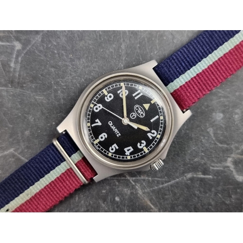 515 - A 1990s military issue CWC 'G10' stainless steel quartz wristwatch, 36mm, having 'Tritium Dial', the... 