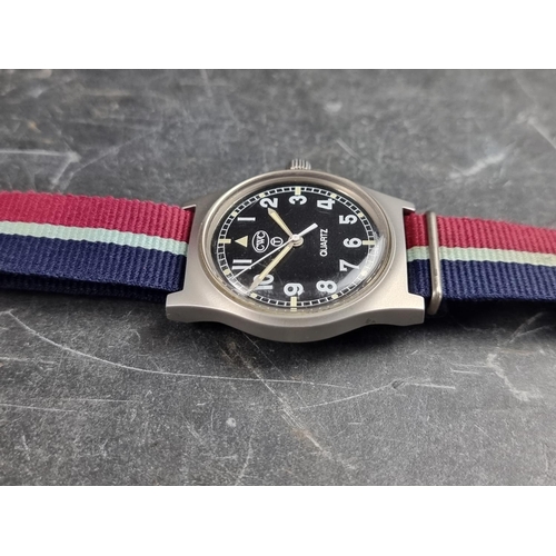 515 - A 1990s military issue CWC 'G10' stainless steel quartz wristwatch, 36mm, having 'Tritium Dial', the... 