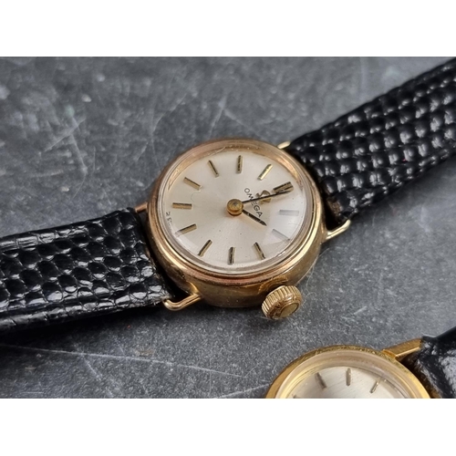 548 - A vintage Omega 18ct gold manual wind ladies wristwatch; together with a similar 9ct gold example, w... 