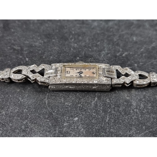 550 - A late 1920s platinum and diamond encrusted manual wind cocktail watch, 10mm x 23mm, on expanding br... 