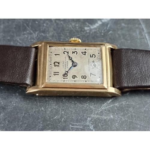 557 - An Art Deco Aero 'Tank' 9ct gold manual wind wristwatch, 23mm x 30mm, Case ref. 99768, on later brow... 