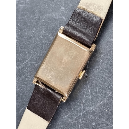 557 - An Art Deco Aero 'Tank' 9ct gold manual wind wristwatch, 23mm x 30mm, Case ref. 99768, on later brow... 