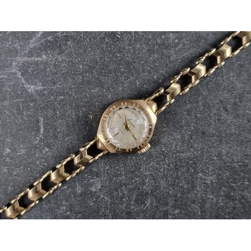 558 - An Accurist 9ct gold manual wind ladies  wristwatch, London 1964, 7.1g.