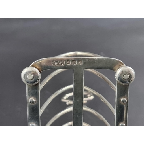 56 - A silver toast rack, by Hukin & Heath Ltd, Birmingham 1922, 13cm wide, 173g.... 