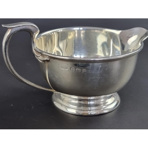 57 - A silver cream jug, by Deakin & Francis Ltd, Birmingham 1924, 7cm high, 114g.