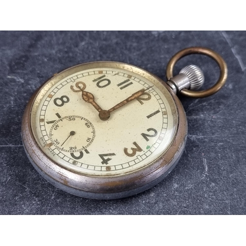 590 - A WWII military GSTP stem wind open face pocket watch, unsigned, engraved to back with broad arrow, ... 